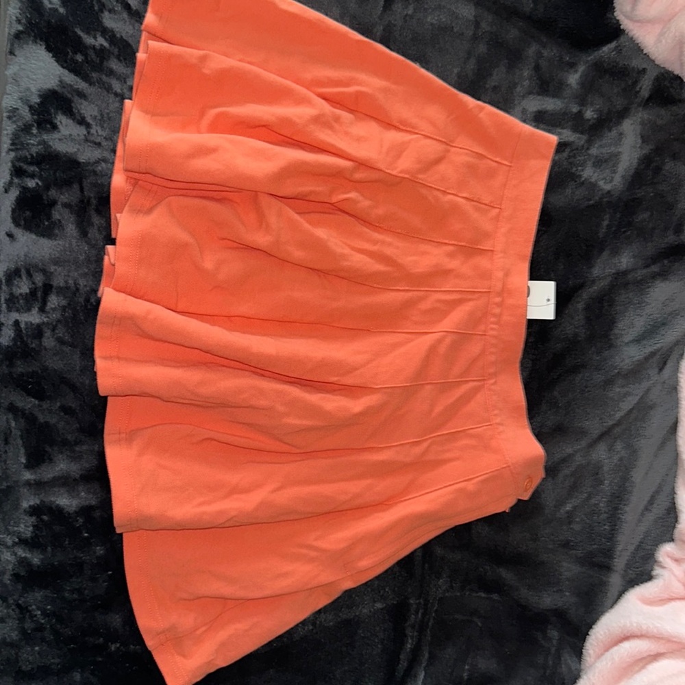 Salmon colored tennis skirt type